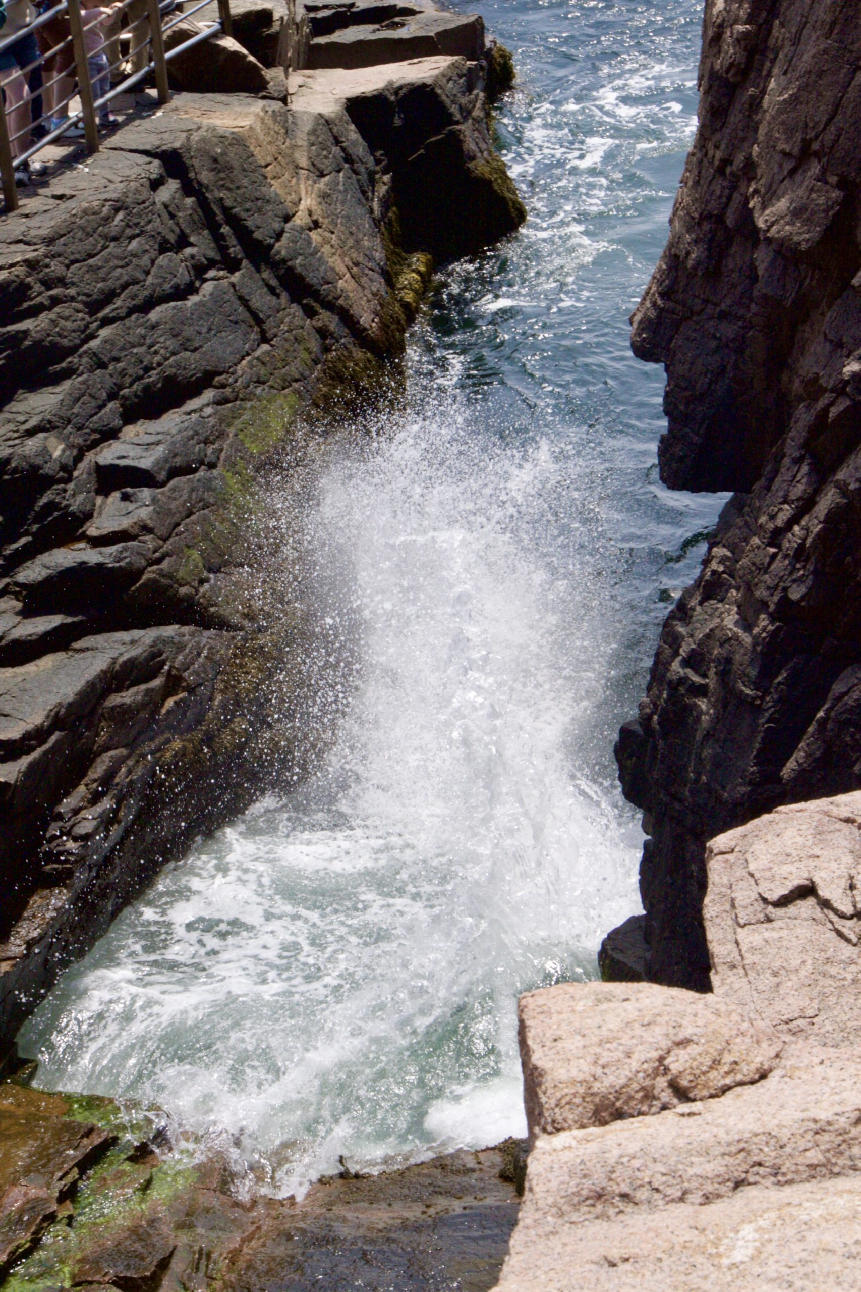 Thunder Hole, a rock crevasse into which waves crash with a great explosion of foam and sound.